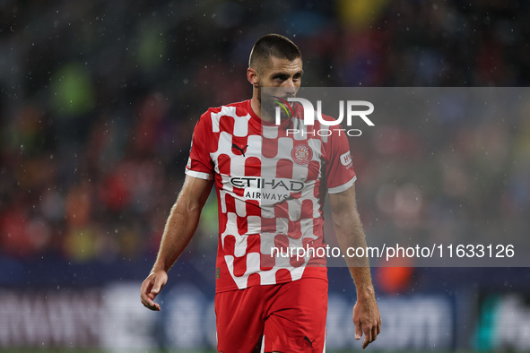 David Lopez of Girona FC participates in the UEFA Champions League 2024/25 League Phase MD2 match between Girona FC and Feyenoord at Estadi...