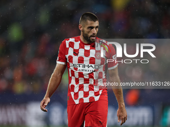 David Lopez of Girona FC participates in the UEFA Champions League 2024/25 League Phase MD2 match between Girona FC and Feyenoord at Estadi...