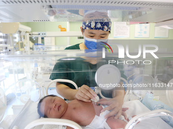 A medical staff member works at his post in the neonatology department of East Hospital in Lianyungang, China, on October 3, 2024. (