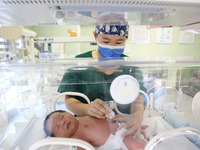 A medical staff member works at his post in the neonatology department of East Hospital in Lianyungang, China, on October 3, 2024. (