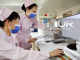 A medical staff member works at his post in the neonatology department of East Hospital in Lianyungang, China, on October 3, 2024. (