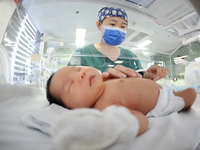 A medical staff member works at his post in the neonatology department of East Hospital in Lianyungang, China, on October 3, 2024. (