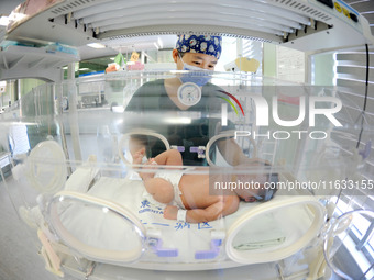 A medical staff member works at his post in the neonatology department of East Hospital in Lianyungang, China, on October 3, 2024. (