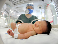 A medical staff member works at his post in the neonatology department of East Hospital in Lianyungang, China, on October 3, 2024. (