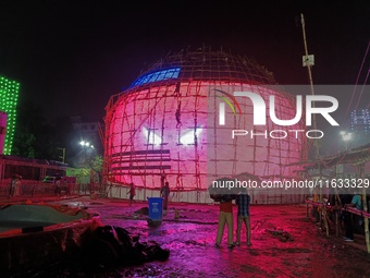 Visitor's Hold Umbrella Amid Heavy Rain And Visiting A Puja Pandal Ahead The Durga Puja Festival In Kolkata, India On October 3,2024.(