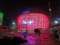 Visitor's Hold Umbrella Amid Heavy Rain And Visiting A Puja Pandal Ahead The Durga Puja Festival In Kolkata, India On October 3,2024.(