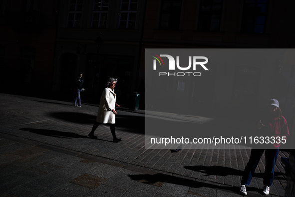 A person walks the street in Krakow, Poland on October 1, 2024. 