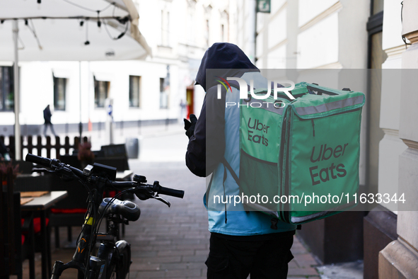 Uber Eats courier is seen in Krakow, Poland on October 1, 2024. 