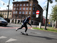 A person rides a skateboard on the street in Krakow, Poland on October 1, 2024. (