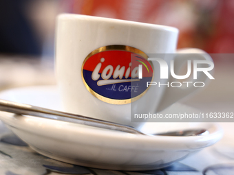 Ionia logo is seen on a cup of coffee in a cafe in this illustration photo taken in Krakow, Poland on October 2, 2024. (