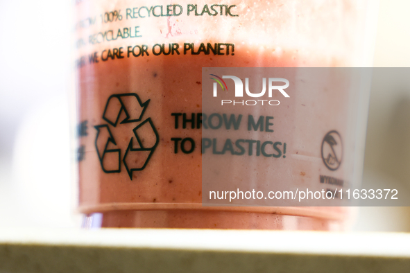 A sign is seen on a plastic cup in this illustration photo taken in Krakow, Poland on October 2, 2024. 