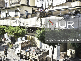 A view shows the destruction of the building and surrounding structures after Israeli warplanes hit a building for the Islamic Health Author...