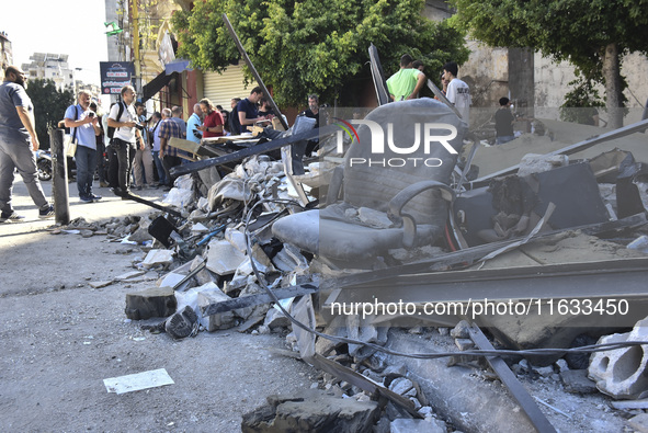 A view shows the destruction of the building and surrounding structures after Israeli warplanes hit a building for the Islamic Health Author...