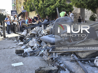 A view shows the destruction of the building and surrounding structures after Israeli warplanes hit a building for the Islamic Health Author...