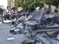 A view shows the destruction of the building and surrounding structures after Israeli warplanes hit a building for the Islamic Health Author...