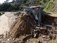 A view of the house damaged by the flood due to heavy rain in a village in Lalitpur district on the outskirts of Kathmandu, Nepal, on Octobe...