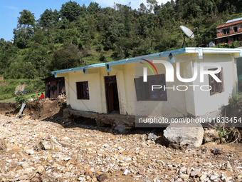 A view of the house damaged by the flood due to heavy rain in a village in Lalitpur district on the outskirts of Kathmandu, Nepal, on Octobe...