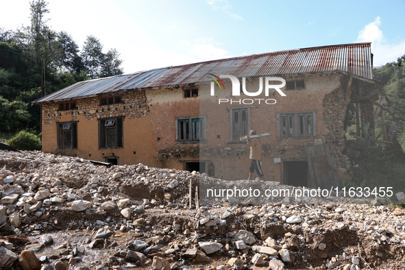 A view of the house damaged by the flood due to heavy rain in a village in Lalitpur district on the outskirts of Kathmandu, Nepal, on Octobe...