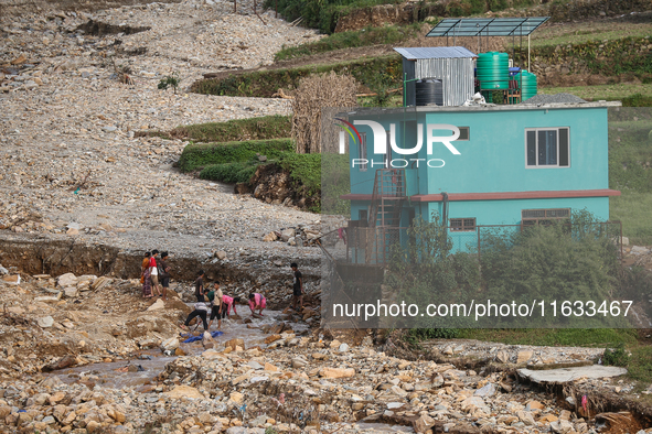 A view of the house damaged by the flood due to heavy rain in a village in Lalitpur district on the outskirts of Kathmandu, Nepal, on Octobe...