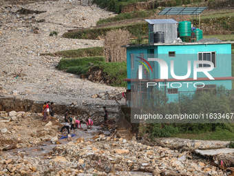 A view of the house damaged by the flood due to heavy rain in a village in Lalitpur district on the outskirts of Kathmandu, Nepal, on Octobe...