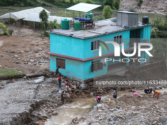 A view of the house damaged by the flood due to heavy rain in a village in Lalitpur district on the outskirts of Kathmandu, Nepal, on Octobe...