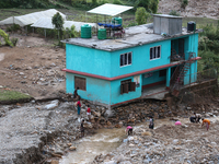 A view of the house damaged by the flood due to heavy rain in a village in Lalitpur district on the outskirts of Kathmandu, Nepal, on Octobe...