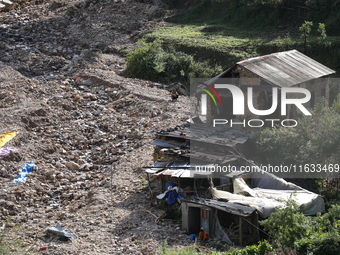 A view of the house damaged by the flood due to heavy rain in a village in Lalitpur district on the outskirts of Kathmandu, Nepal, on Octobe...