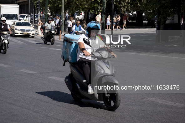 A Wolt delivery driver rides his motorcycle in the center of Athens, Greece, on October 3, 2024. Wolt is the second most popular delivery co...