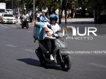 A Wolt delivery driver rides his motorcycle in the center of Athens, Greece, on October 3, 2024. Wolt is the second most popular delivery co...