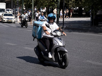 A Wolt delivery driver rides his motorcycle in the center of Athens, Greece, on October 3, 2024. Wolt is the second most popular delivery co...