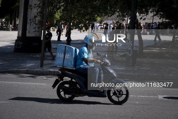 A Wolt delivery driver rides his motorcycle in the center of Athens, Greece, on October 3, 2024. Wolt is the second most popular delivery co...