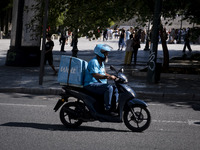 A Wolt delivery driver rides his motorcycle in the center of Athens, Greece, on October 3, 2024. Wolt is the second most popular delivery co...