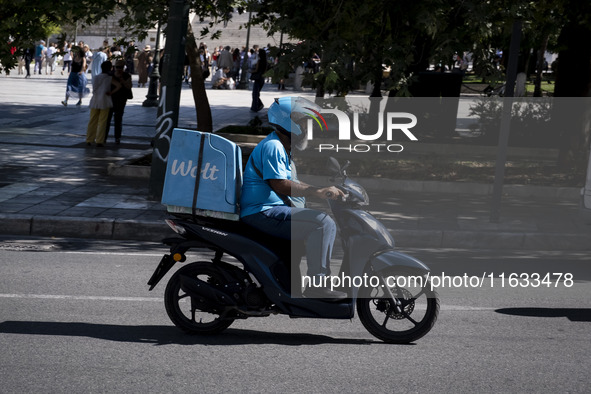 A Wolt delivery driver rides his motorcycle in the center of Athens, Greece, on October 3, 2024. Wolt is the second most popular delivery co...