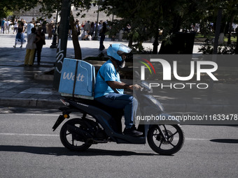 A Wolt delivery driver rides his motorcycle in the center of Athens, Greece, on October 3, 2024. Wolt is the second most popular delivery co...