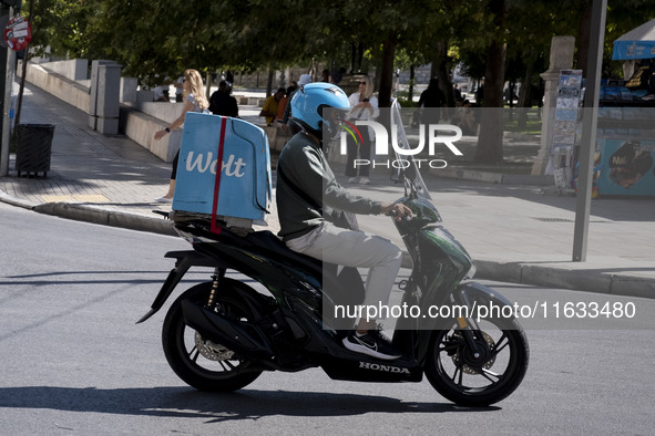 A Wolt delivery driver rides his motorcycle in the center of Athens, Greece, on October 3, 2024. Wolt is the second most popular delivery co...