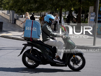 A Wolt delivery driver rides his motorcycle in the center of Athens, Greece, on October 3, 2024. Wolt is the second most popular delivery co...