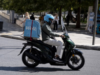 A Wolt delivery driver rides his motorcycle in the center of Athens, Greece, on October 3, 2024. Wolt is the second most popular delivery co...