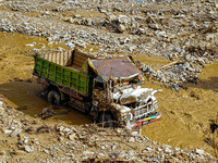 Flooding from the Salamdo River sweeps and damages a vehicle in Patikharka, Kavrepalanchok District, Nepal, on October 3, 2024. (