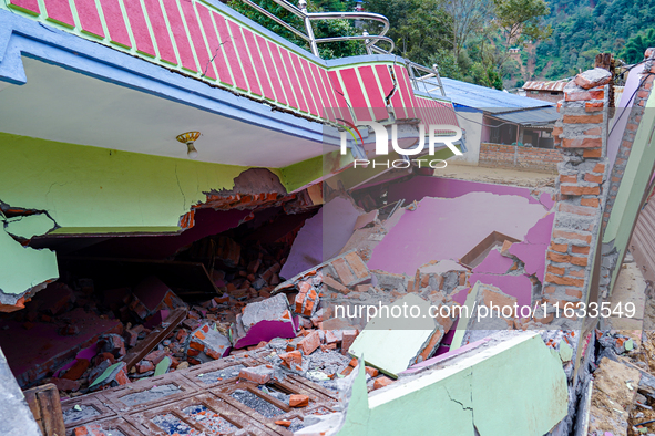 Salamdo River flooding damages homes in Patikharka of Kavrepalanchok District, Nepal, on October 3, 2024. Homes are severely damaged, with m...