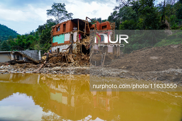 Salamdo River flooding damages homes in Patikharka of Kavrepalanchok District, Nepal, on October 3, 2024. Homes are severely damaged, with m...