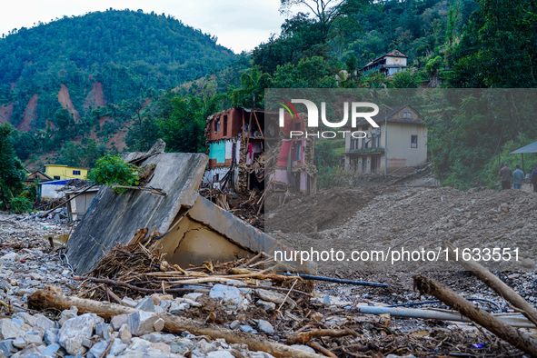 Salamdo River flooding damages homes in Patikharka of Kavrepalanchok District, Nepal, on October 3, 2024. Homes are severely damaged, with m...