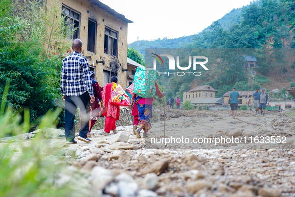 Due to heavy rainfall, the Salamdo River flood damages the road in Patikharka, Kavrepalanchok District, Nepal, on October 3, 2024. People ha...