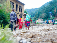 Due to heavy rainfall, the Salamdo River flood damages the road in Patikharka, Kavrepalanchok District, Nepal, on October 3, 2024. People ha...