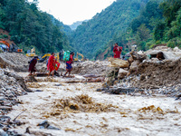 Due to heavy rainfall, the Salamdo River flood damages the road in Patikharka, Kavrepalanchok District, Nepal, on October 3, 2024. People ha...