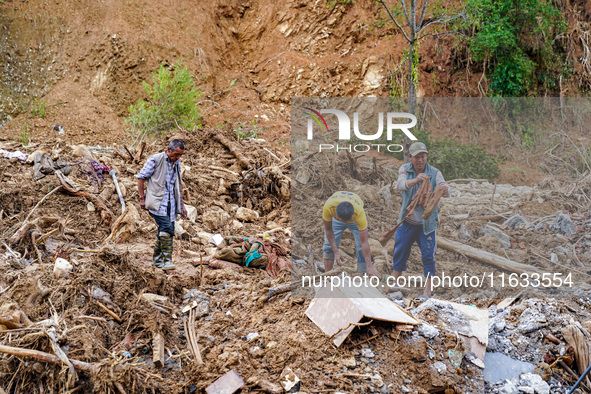 People search for their belongings in damaged houses due to Salamdo River flooding in Patikharka of Kavrepalanchok District, Nepal, on Octob...