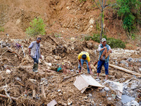 People search for their belongings in damaged houses due to Salamdo River flooding in Patikharka of Kavrepalanchok District, Nepal, on Octob...