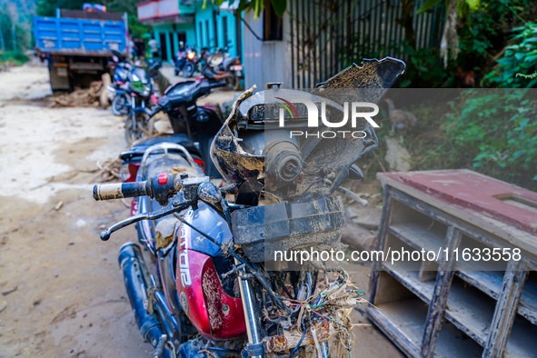 A flood-damaged bike is from the Salamdo River in Patikharka, Kavrepalanchok District, Nepal, on October 3, 2024. 