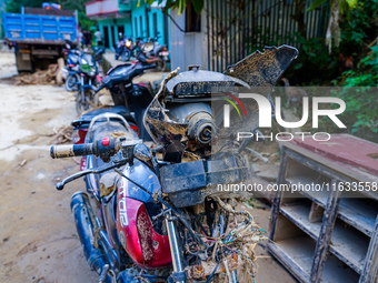 A flood-damaged bike is from the Salamdo River in Patikharka, Kavrepalanchok District, Nepal, on October 3, 2024. (