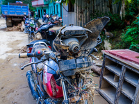 A flood-damaged bike is from the Salamdo River in Patikharka, Kavrepalanchok District, Nepal, on October 3, 2024. (