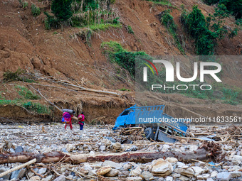 Due to heavy rainfall, the Salamdo River flood damages the road in Patikharka, Kavrepalanchok District, Nepal, on October 3, 2024. People ha...